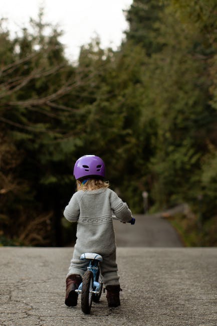Small kid on a balance bike