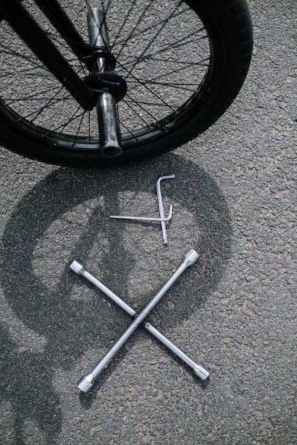 Bike wheel with tools on the floor